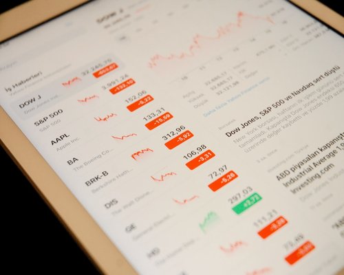 Close up of a digital tablet displaying exchange rate basics and educational materials